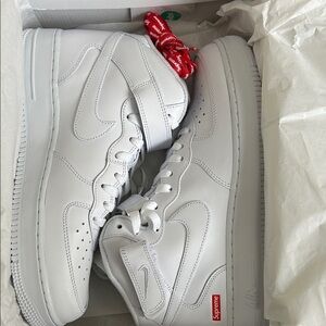 Supreme White Leather Sneakers with Red Accents
New